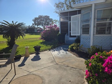 This well maintained 2/2 home is located on the golf course in on Lake Henry Golf Club in Florida - for sale on GolfHomes.com, golf home, golf lot