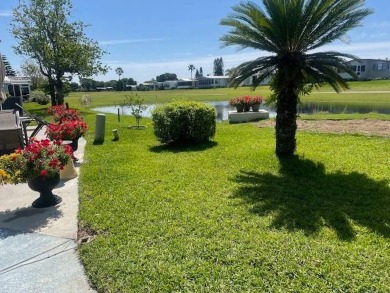 This well maintained 2/2 home is located on the golf course in on Lake Henry Golf Club in Florida - for sale on GolfHomes.com, golf home, golf lot