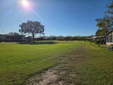 This well maintained 2/2 home is located on the golf course in on Lake Henry Golf Club in Florida - for sale on GolfHomes.com, golf home, golf lot