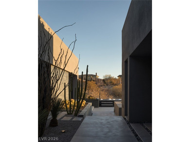 Pristine symmetrical landscaping paves your entrance into this on Bears Best Las Vegas Golf Club in Nevada - for sale on GolfHomes.com, golf home, golf lot