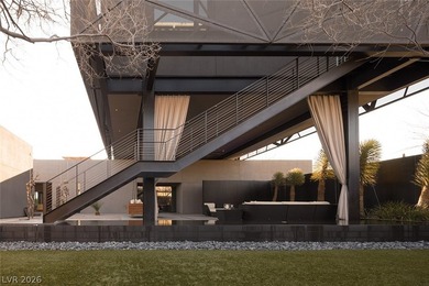 Pristine symmetrical landscaping paves your entrance into this on Bears Best Las Vegas Golf Club in Nevada - for sale on GolfHomes.com, golf home, golf lot