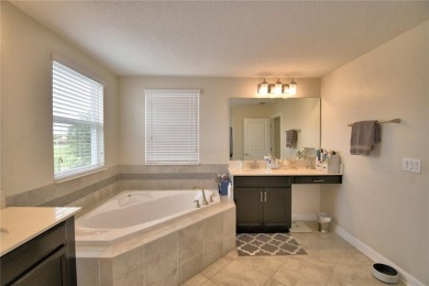 Located in the exclusive, gated community of ChampionsGate on The Oasis Club at Champions Gate in Florida - for sale on GolfHomes.com, golf home, golf lot