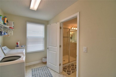 Located in the exclusive, gated community of ChampionsGate on The Oasis Club at Champions Gate in Florida - for sale on GolfHomes.com, golf home, golf lot