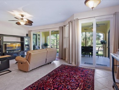 THIS BEAUTIFULLY APPOINTED THREE BEDROOM TWO BATH COACH HOME IS on Hammock Bay in Florida - for sale on GolfHomes.com, golf home, golf lot