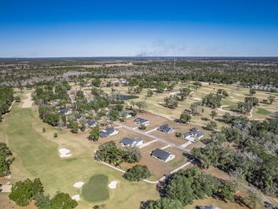 Move-in Ready! Exquisite new construction overlooking hole 6 of on Wildwood Country Club in Florida - for sale on GolfHomes.com, golf home, golf lot