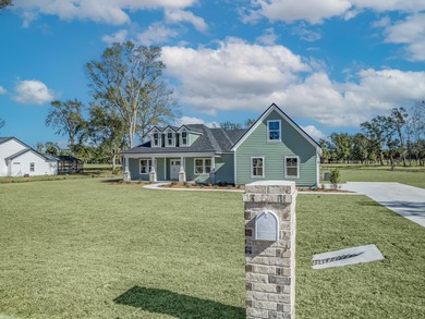 Move-in Ready! Exquisite new construction overlooking hole 6 of on Wildwood Country Club in Florida - for sale on GolfHomes.com, golf home, golf lot