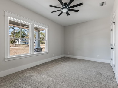 Move-in Ready! Exquisite new construction overlooking hole 6 of on Wildwood Country Club in Florida - for sale on GolfHomes.com, golf home, golf lot