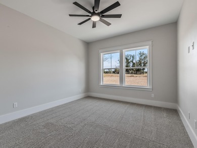 Move-in Ready! Exquisite new construction overlooking hole 6 of on Wildwood Country Club in Florida - for sale on GolfHomes.com, golf home, golf lot