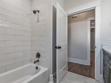 Move-in Ready! Exquisite new construction overlooking hole 6 of on Wildwood Country Club in Florida - for sale on GolfHomes.com, golf home, golf lot