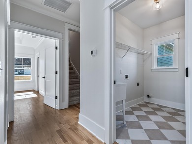 Move-in Ready! Exquisite new construction overlooking hole 6 of on Wildwood Country Club in Florida - for sale on GolfHomes.com, golf home, golf lot