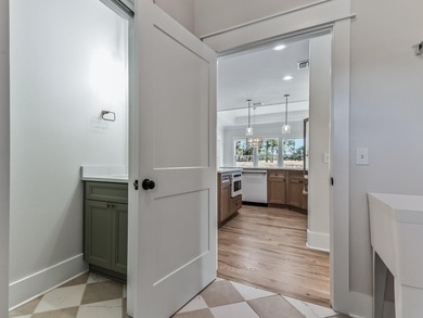 Move-in Ready! Exquisite new construction overlooking hole 6 of on Wildwood Country Club in Florida - for sale on GolfHomes.com, golf home, golf lot