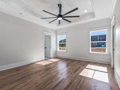 Move-in Ready! Exquisite new construction overlooking hole 6 of on Wildwood Country Club in Florida - for sale on GolfHomes.com, golf home, golf lot