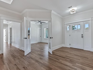 Move-in Ready! Exquisite new construction overlooking hole 6 of on Wildwood Country Club in Florida - for sale on GolfHomes.com, golf home, golf lot