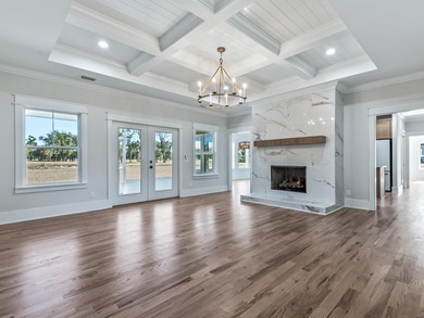 Move-in Ready! Exquisite new construction overlooking hole 6 of on Wildwood Country Club in Florida - for sale on GolfHomes.com, golf home, golf lot