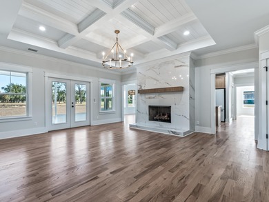 Move-in Ready! Exquisite new construction overlooking hole 6 of on Wildwood Country Club in Florida - for sale on GolfHomes.com, golf home, golf lot