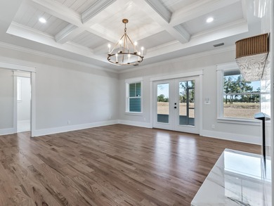 Move-in Ready! Exquisite new construction overlooking hole 6 of on Wildwood Country Club in Florida - for sale on GolfHomes.com, golf home, golf lot