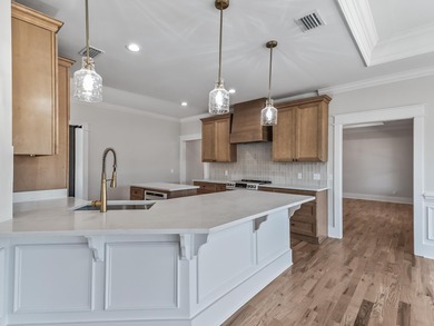 Move-in Ready! Exquisite new construction overlooking hole 6 of on Wildwood Country Club in Florida - for sale on GolfHomes.com, golf home, golf lot