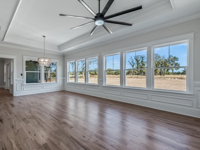 Move-in Ready! Exquisite new construction overlooking hole 6 of on Wildwood Country Club in Florida - for sale on GolfHomes.com, golf home, golf lot