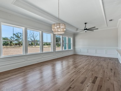 Move-in Ready! Exquisite new construction overlooking hole 6 of on Wildwood Country Club in Florida - for sale on GolfHomes.com, golf home, golf lot