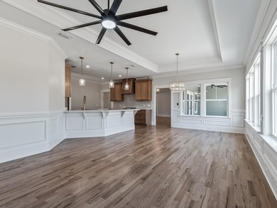 Move-in Ready! Exquisite new construction overlooking hole 6 of on Wildwood Country Club in Florida - for sale on GolfHomes.com, golf home, golf lot