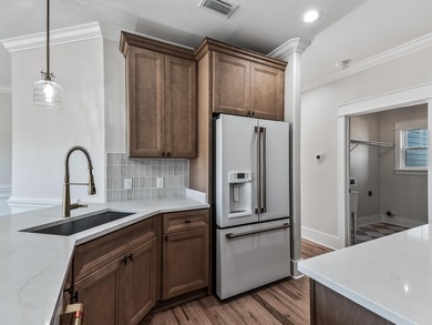 Move-in Ready! Exquisite new construction overlooking hole 6 of on Wildwood Country Club in Florida - for sale on GolfHomes.com, golf home, golf lot