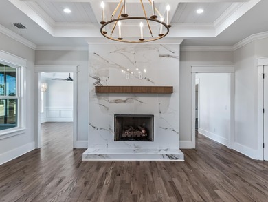 Move-in Ready! Exquisite new construction overlooking hole 6 of on Wildwood Country Club in Florida - for sale on GolfHomes.com, golf home, golf lot