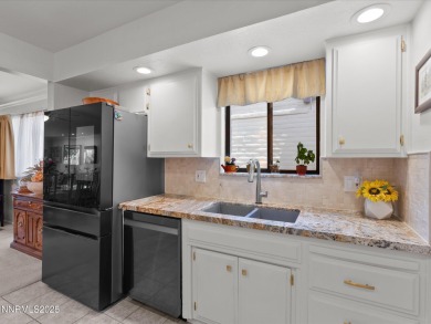 Discover the perfect blend of elegance, comfort, and natural on LakeRidge Golf Course in Nevada - for sale on GolfHomes.com, golf home, golf lot