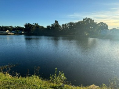 Awe inspiring views of the water and florida wildlife await you on Golden Lakes Golf Course in Florida - for sale on GolfHomes.com, golf home, golf lot