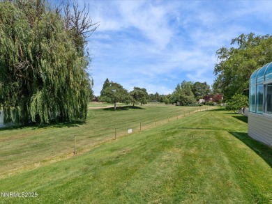 Discover the perfect blend of elegance, comfort, and natural on LakeRidge Golf Course in Nevada - for sale on GolfHomes.com, golf home, golf lot