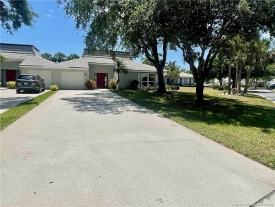 This 2/2 plus den with a 1 car garage is set on a peaceful lake on Martin Downs Country Club in Florida - for sale on GolfHomes.com, golf home, golf lot