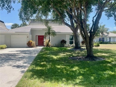 This 2/2 plus den with a 1 car garage is set on a peaceful lake on Martin Downs Country Club in Florida - for sale on GolfHomes.com, golf home, golf lot