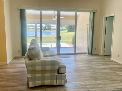 This 2/2 plus den with a 1 car garage is set on a peaceful lake on Martin Downs Country Club in Florida - for sale on GolfHomes.com, golf home, golf lot