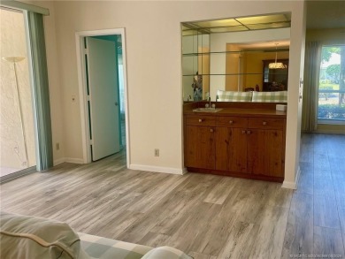 This 2/2 plus den with a 1 car garage is set on a peaceful lake on Martin Downs Country Club in Florida - for sale on GolfHomes.com, golf home, golf lot