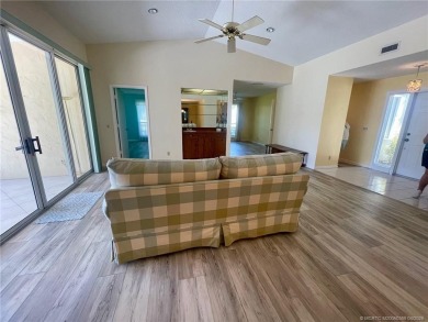 This 2/2 plus den with a 1 car garage is set on a peaceful lake on Martin Downs Country Club in Florida - for sale on GolfHomes.com, golf home, golf lot