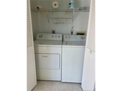 This 2/2 plus den with a 1 car garage is set on a peaceful lake on Martin Downs Country Club in Florida - for sale on GolfHomes.com, golf home, golf lot