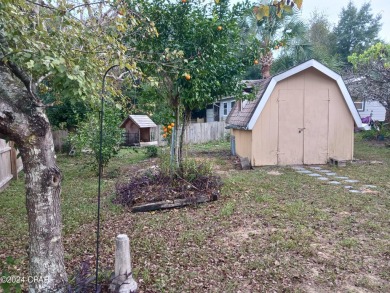 As one of the original sturdy concrete block homes that was on Sunny Hills Golf and Country Club in Florida - for sale on GolfHomes.com, golf home, golf lot