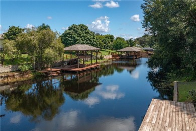 WATERFRONT HOME on CANAL TO BEAUTIFUL LAKE JUNE-- A Pool home on Placid Lakes Country Club in Florida - for sale on GolfHomes.com, golf home, golf lot