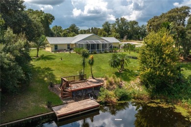 WATERFRONT HOME on CANAL TO BEAUTIFUL LAKE JUNE-- A Pool home on Placid Lakes Country Club in Florida - for sale on GolfHomes.com, golf home, golf lot