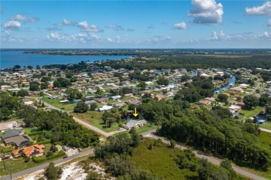 WATERFRONT HOME on CANAL TO BEAUTIFUL LAKE JUNE-- A Pool home on Placid Lakes Country Club in Florida - for sale on GolfHomes.com, golf home, golf lot