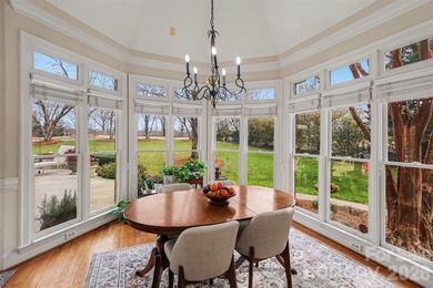 Welcome to this beautifully updated 4-bedroom, 3.5-bath home on TPC at Piper Glen in North Carolina - for sale on GolfHomes.com, golf home, golf lot