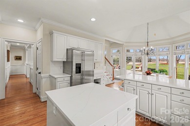 Welcome to this beautifully updated 4-bedroom, 3.5-bath home on TPC at Piper Glen in North Carolina - for sale on GolfHomes.com, golf home, golf lot