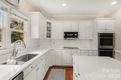 Welcome to this beautifully updated 4-bedroom, 3.5-bath home on TPC at Piper Glen in North Carolina - for sale on GolfHomes.com, golf home, golf lot