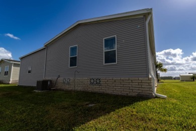 Welcome to this charming 2022 Palm Harbor home nestled in the on Lily Lake Golf and RV Resort in Florida - for sale on GolfHomes.com, golf home, golf lot