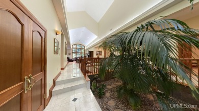 This executive home features 6750 sq. ft. Conveniently located on Marquette Golf Club in Michigan - for sale on GolfHomes.com, golf home, golf lot