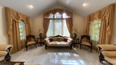 This executive home features 6750 sq. ft. Conveniently located on Marquette Golf Club in Michigan - for sale on GolfHomes.com, golf home, golf lot