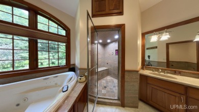 This executive home features 6750 sq. ft. Conveniently located on Marquette Golf Club in Michigan - for sale on GolfHomes.com, golf home, golf lot