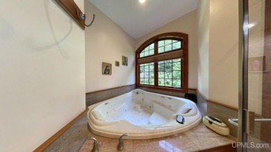 This executive home features 6750 sq. ft. Conveniently located on Marquette Golf Club in Michigan - for sale on GolfHomes.com, golf home, golf lot