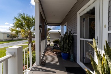 Welcome to this charming 2022 Palm Harbor home nestled in the on Lily Lake Golf and RV Resort in Florida - for sale on GolfHomes.com, golf home, golf lot