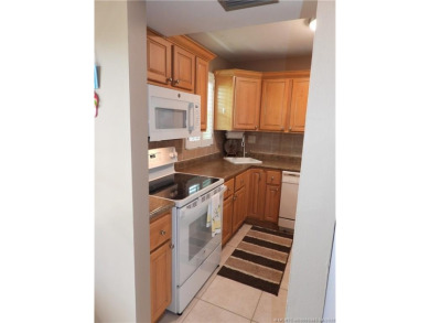 Welcome home to this updated 2 bedroom, 1 bathroom condo on Monterey Yacht and Country Club in Florida - for sale on GolfHomes.com, golf home, golf lot
