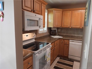 Welcome home to this updated 2 bedroom, 1 bathroom condo on Monterey Yacht and Country Club in Florida - for sale on GolfHomes.com, golf home, golf lot